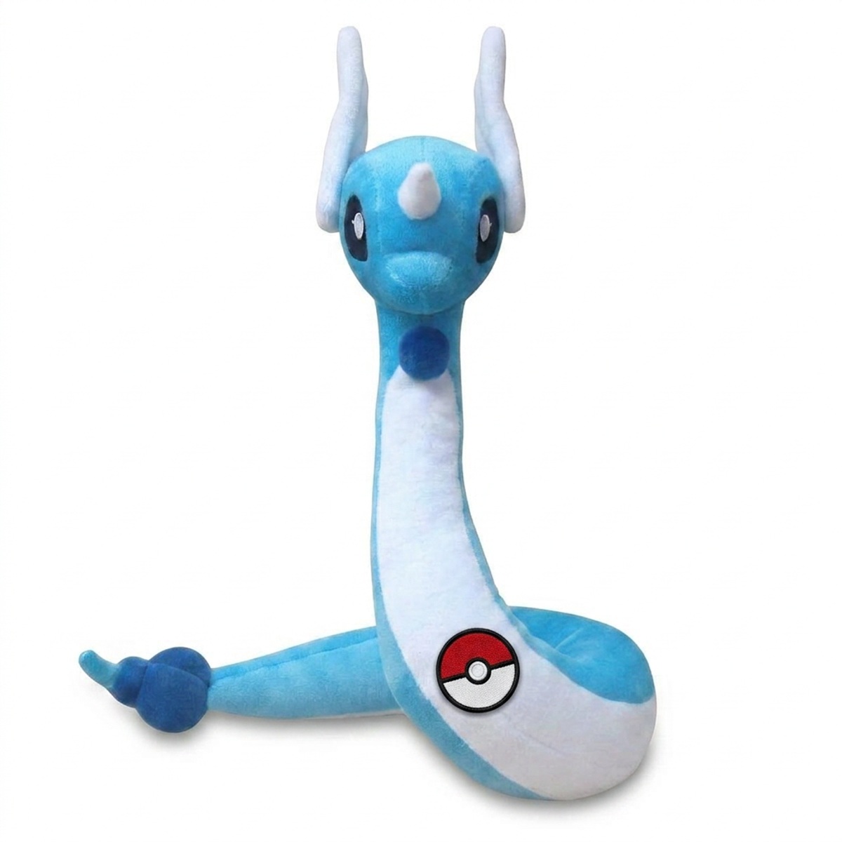 Peluche Draco avec badge prouvant l'authenticité du produit.