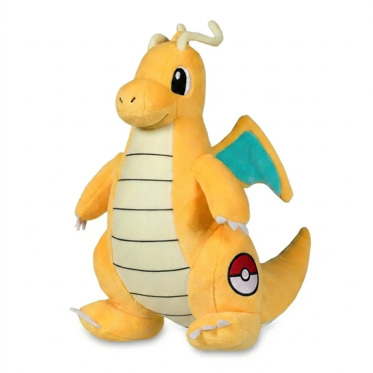 Peluche Dracolosse avec badge prouvant l'authenticité du produit.