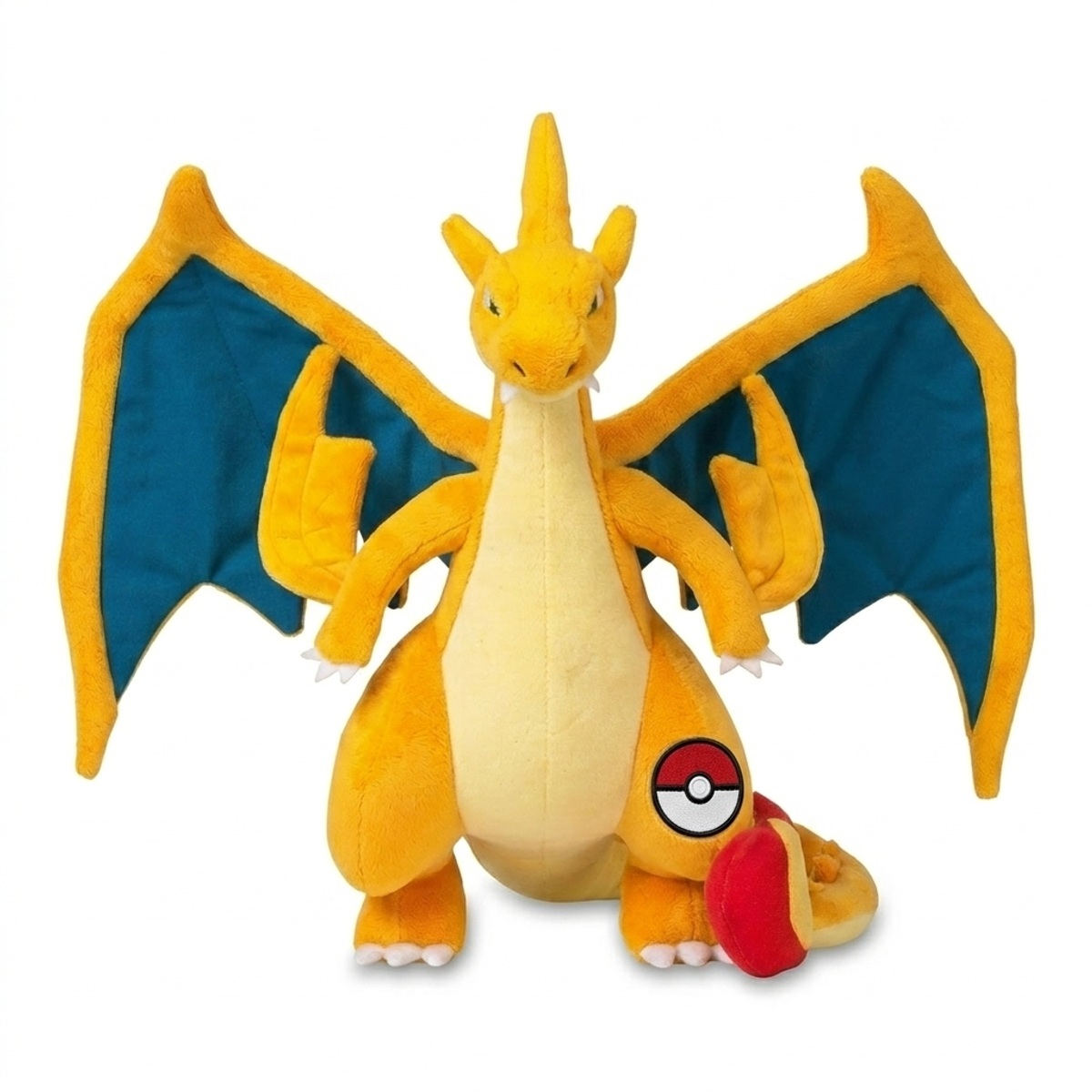 Peluche Dracaufeu avec badge prouvant l'authenticité du produit.