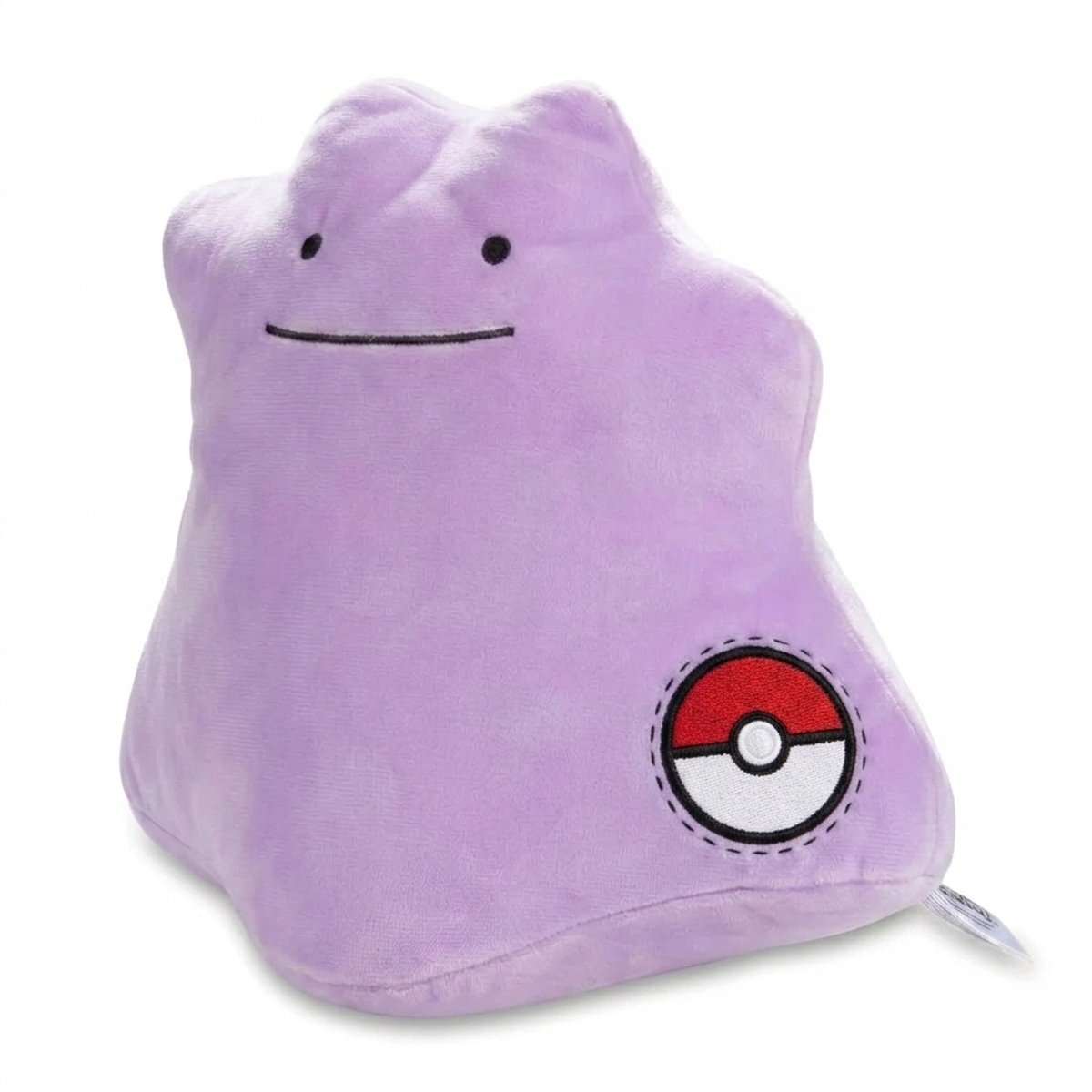 Peluche Métamorph avec badge prouvant l'authenticité du produit.