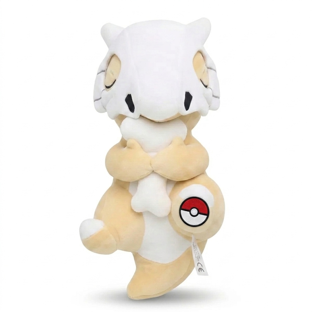 Peluche Osselait avec badge prouvant l'authenticité du produit.