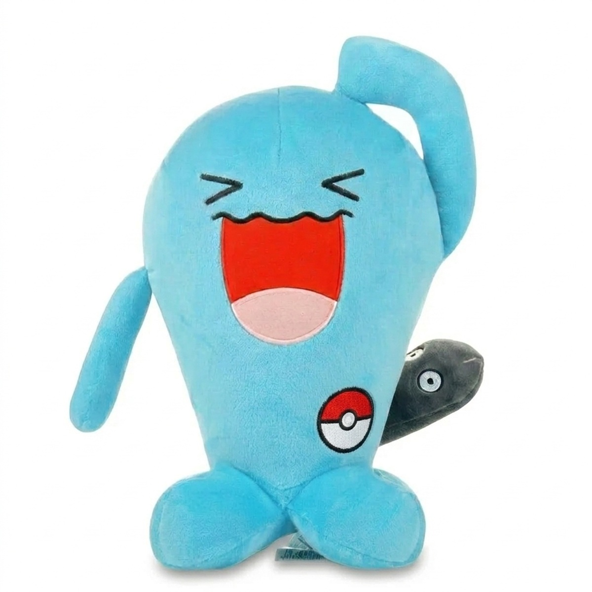 Peluche Qulbutoké avec badge prouvant l'authenticité du produit.