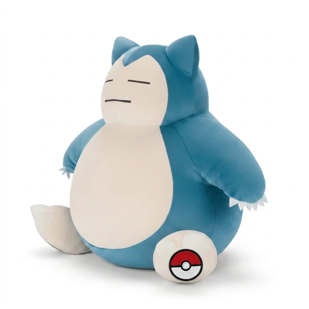 Peluche Ronflex avec badge prouvant l'authenticité du produit.