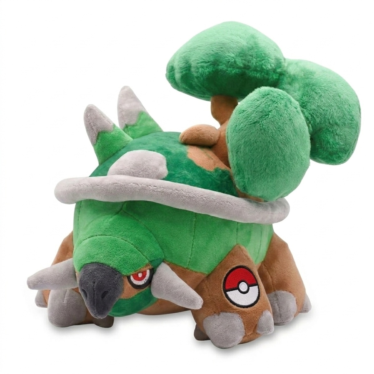 Peluche Torterra avec badge prouvant l'authenticité du produit.