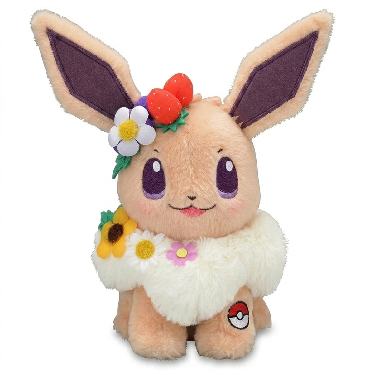 Peluche Évoli avec badge prouvant l'authenticité du produit.
