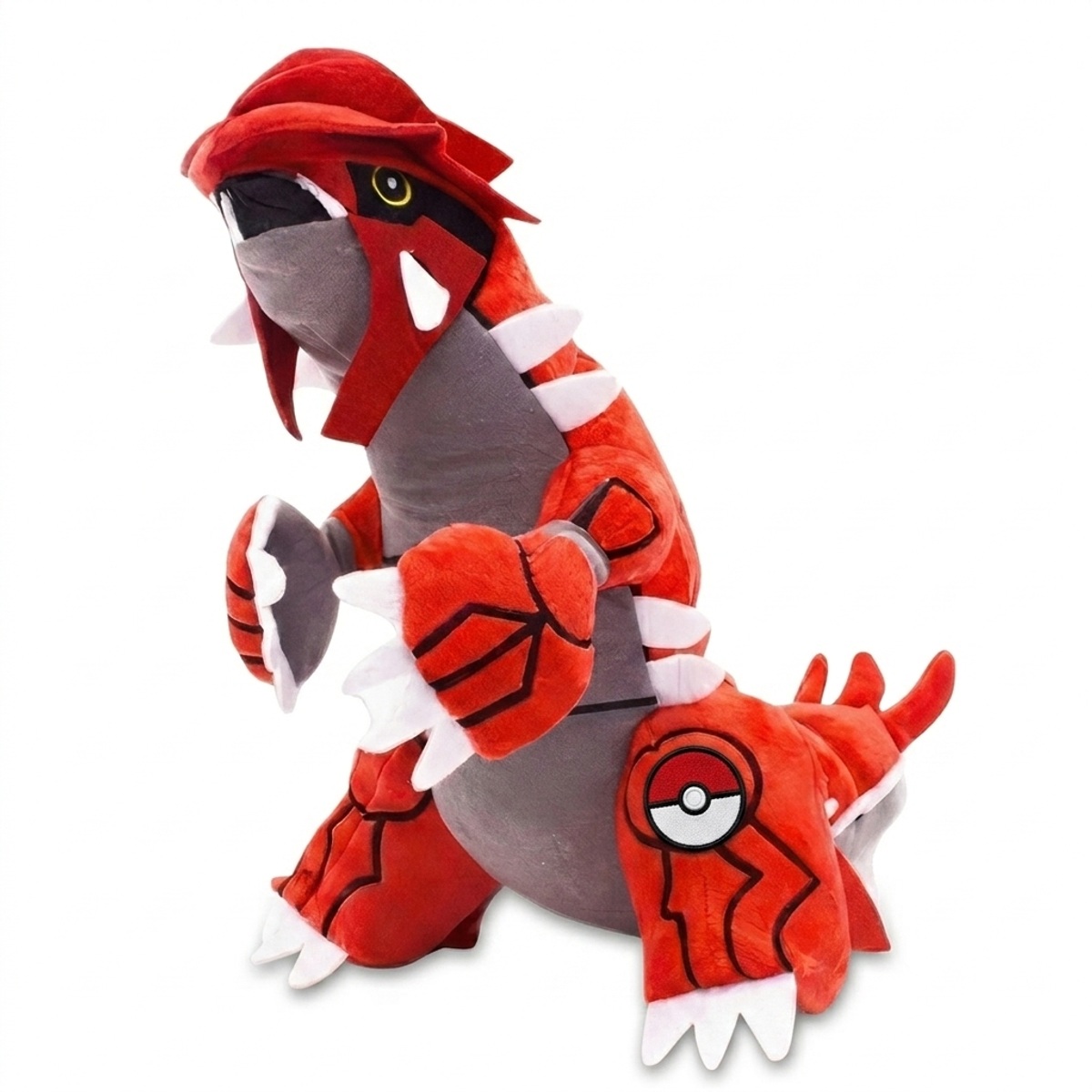 Peluche Groudon avec badge prouvant l'authenticité du produit.