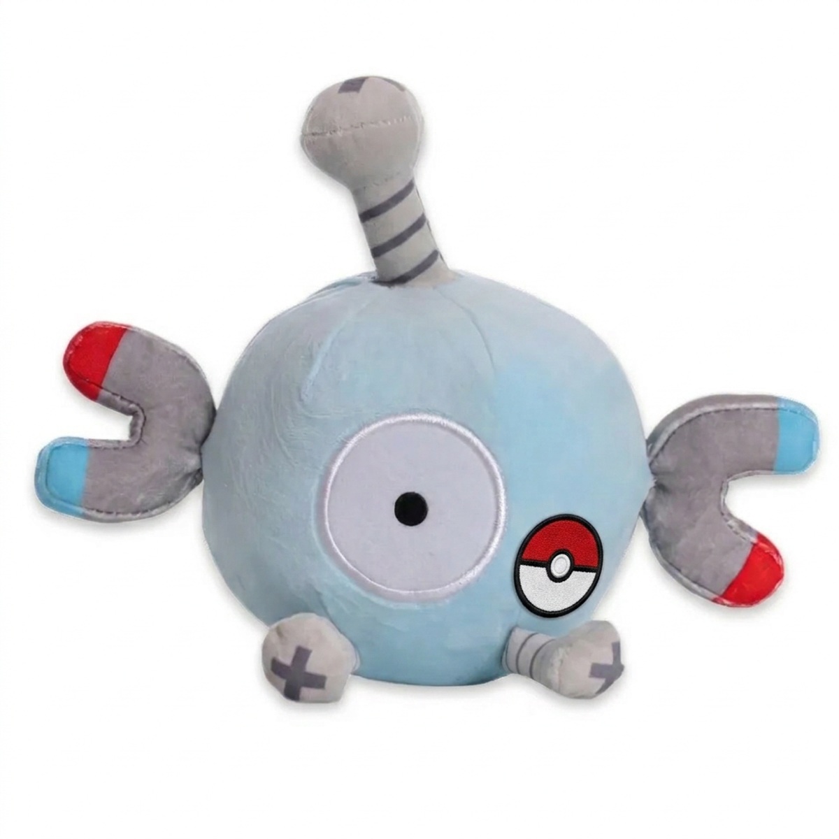 Peluche Magnéti avec badge prouvant l'authenticité du produit.