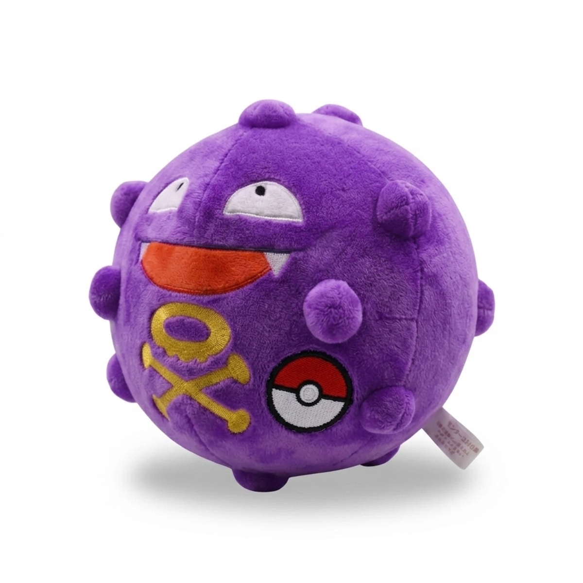 Peluche Smogo avec badge prouvant l'authenticité du produit.