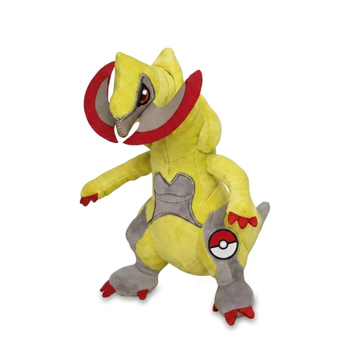 Peluche Tranchodon avec badge prouvant l'authenticité du produit.