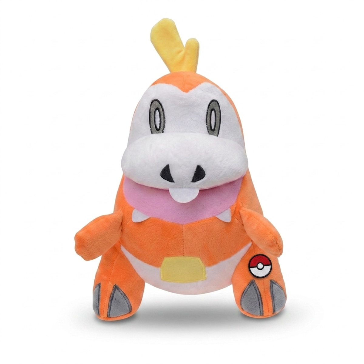Peluche Chochodile avec badge prouvant l'authenticité du produit.