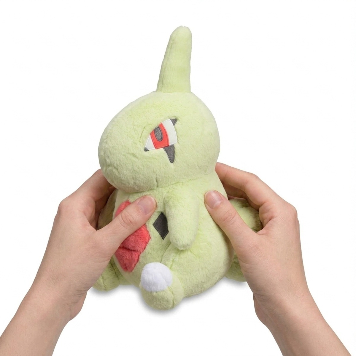Peluche Embrylex tenue dans les mains
