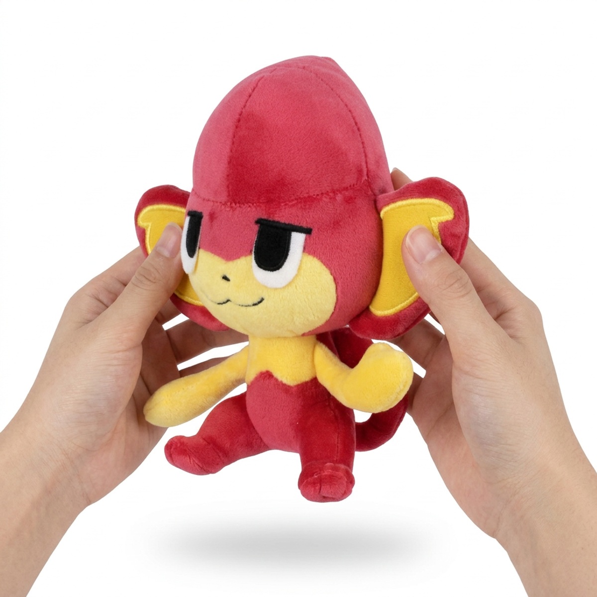 Peluche Flamajou tenue dans les mains