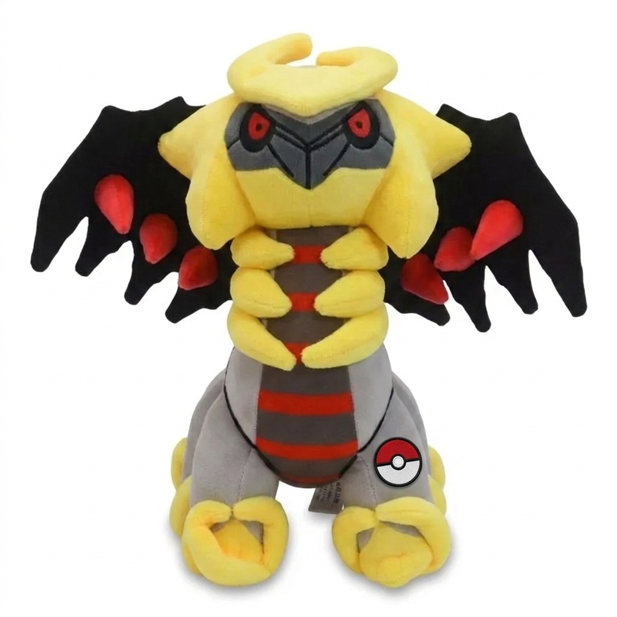 Peluche Giratina avec badge prouvant l'authenticité du produit.