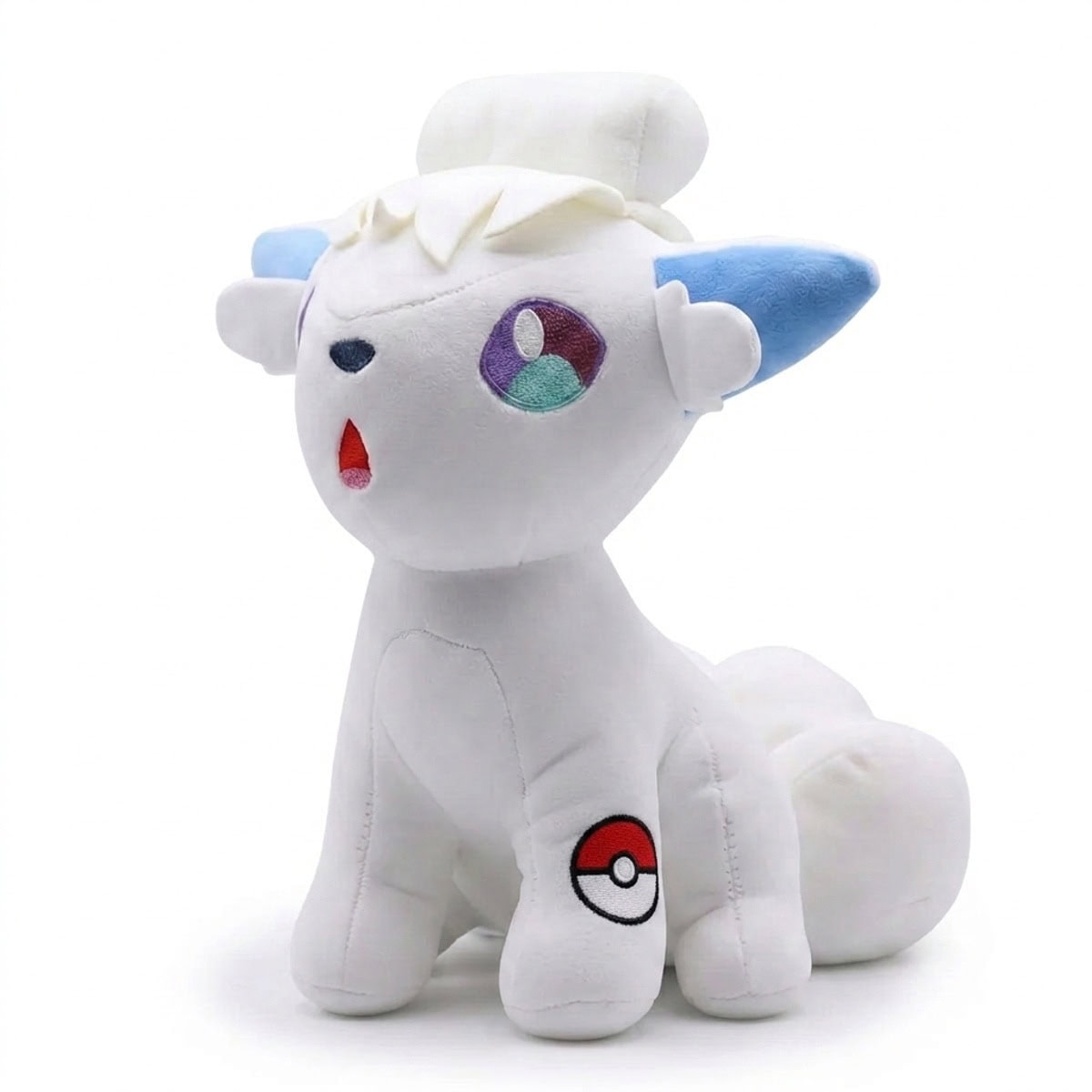 Peluche Goupix avec badge prouvant l'authenticité du produit.