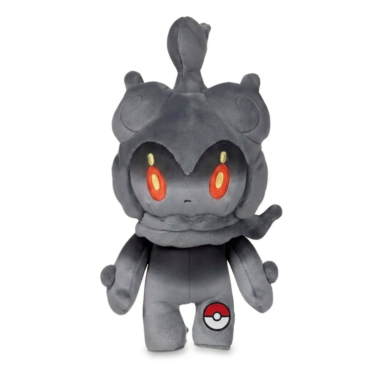 Peluche Marshadow avec badge prouvant l'authenticité du produit.