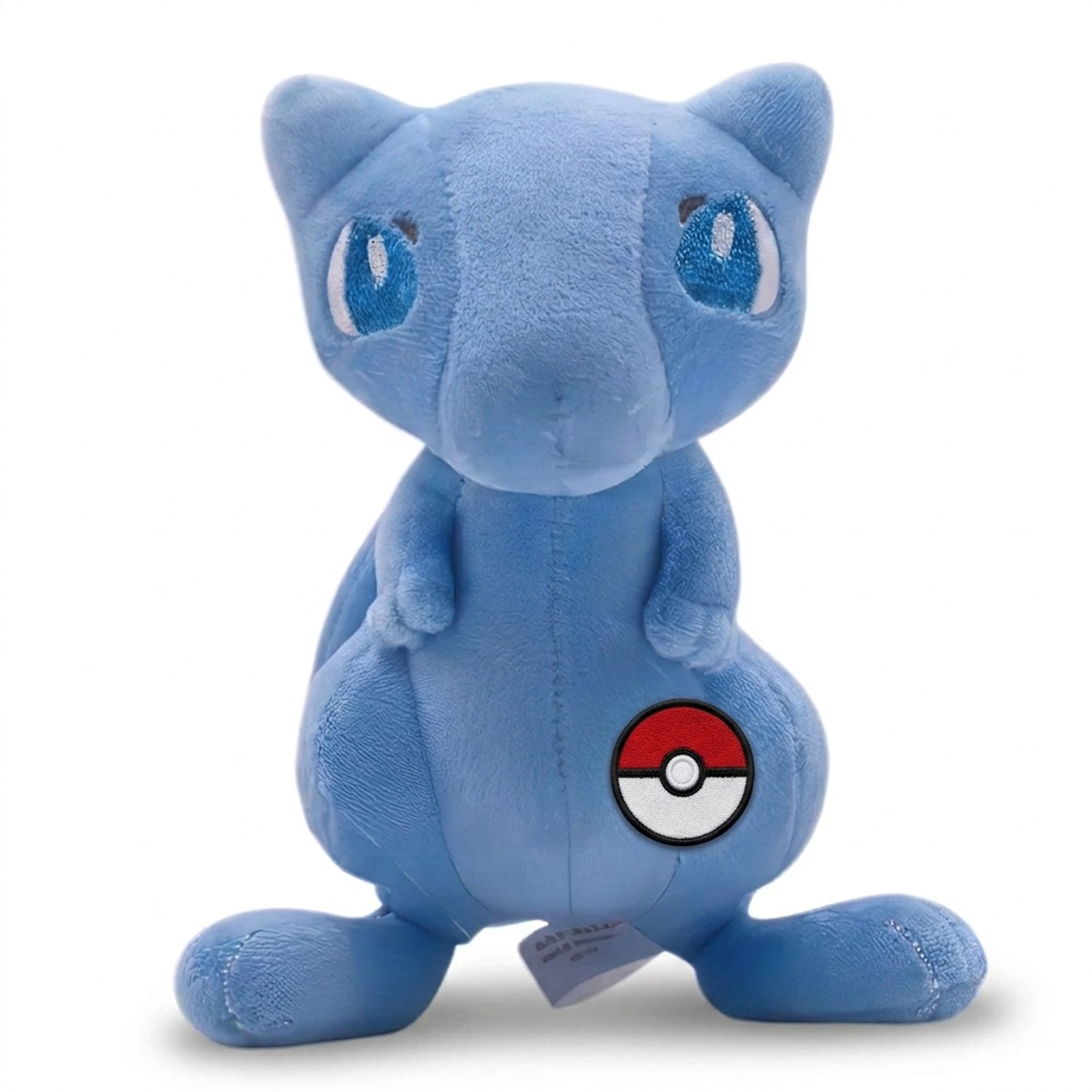 Peluche Mew avec badge prouvant l'authenticité du produit.