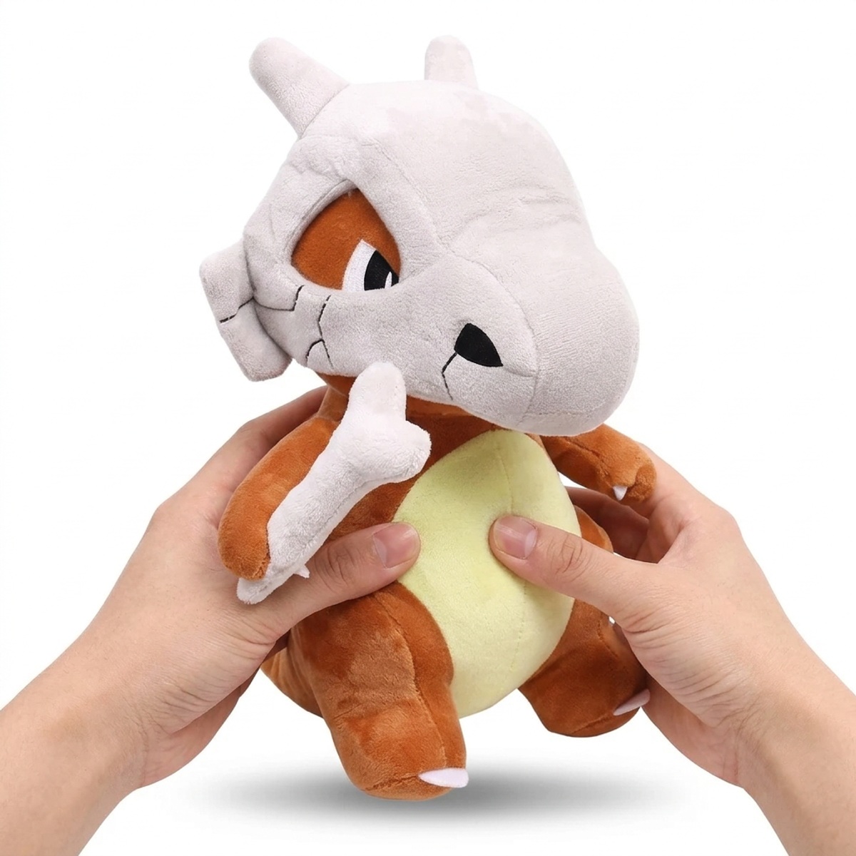 Peluche Osselait tenue dans les mains